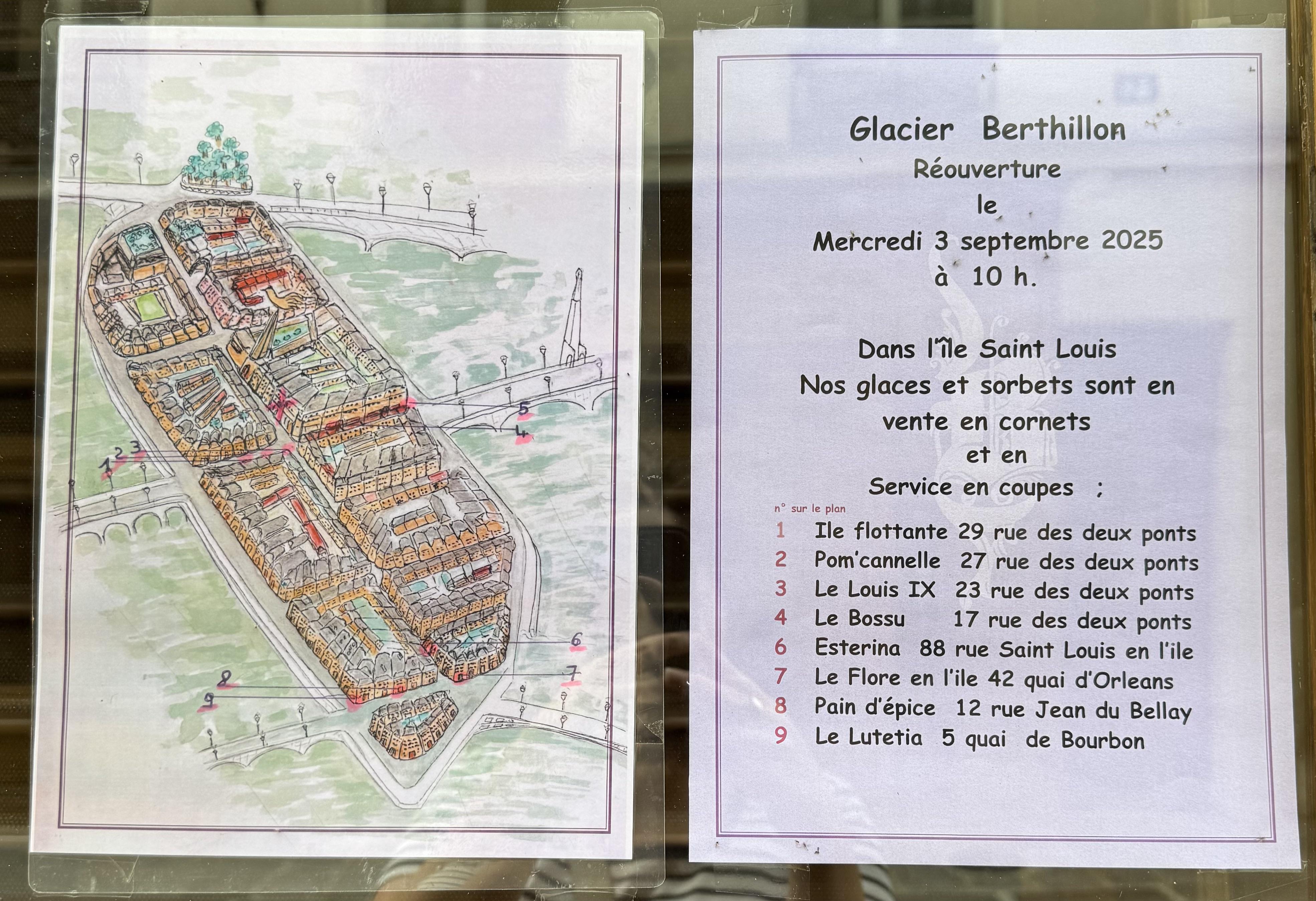 two posters in the store window. On the left you have a map of the island with the other places to find the famous Berthillon ice cream. On the right there is a sign saying they'll reopen on the 3rd September with a list of the addresses on where to find the ice cream