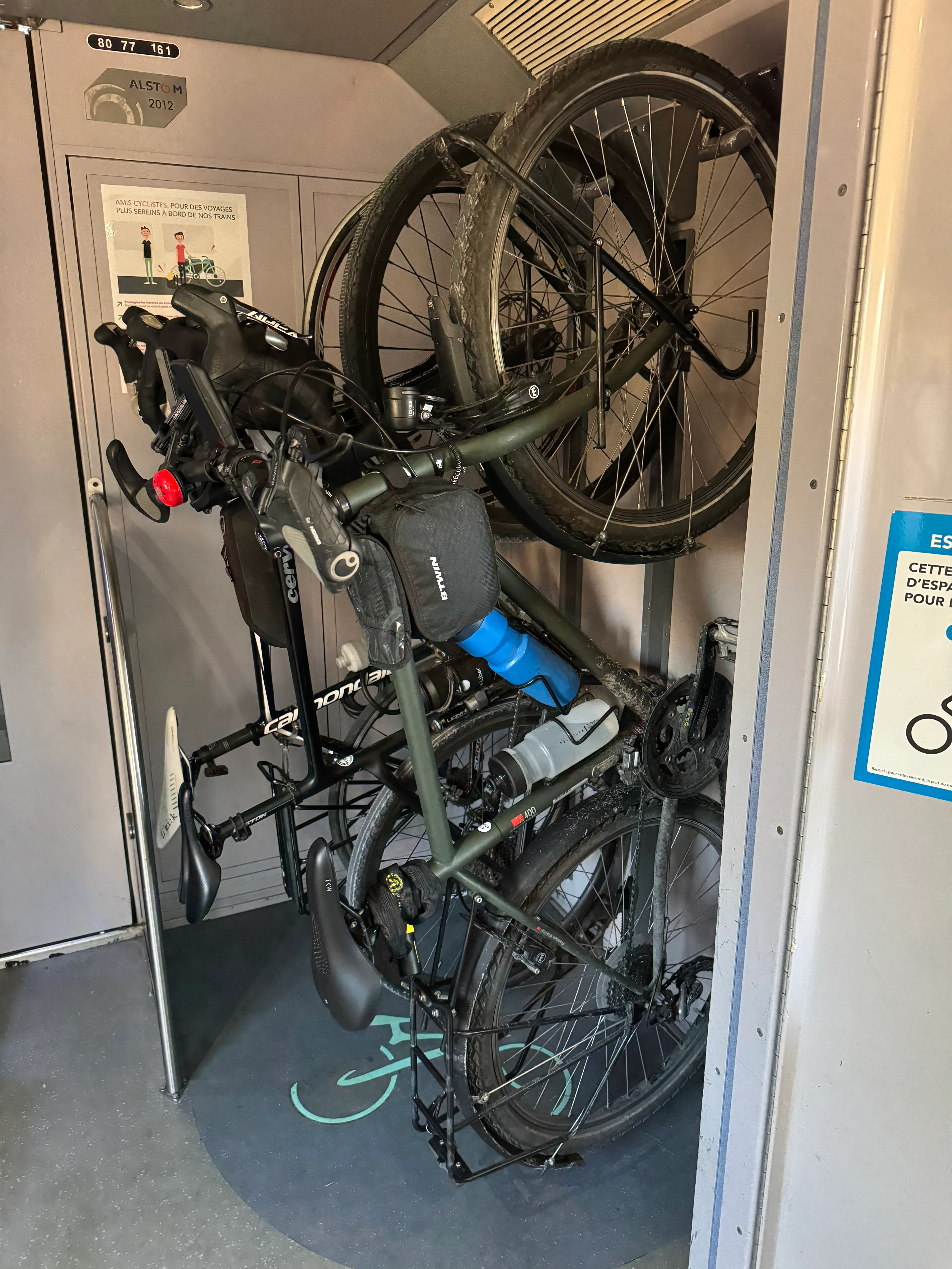 three bikes hanging up next to each other