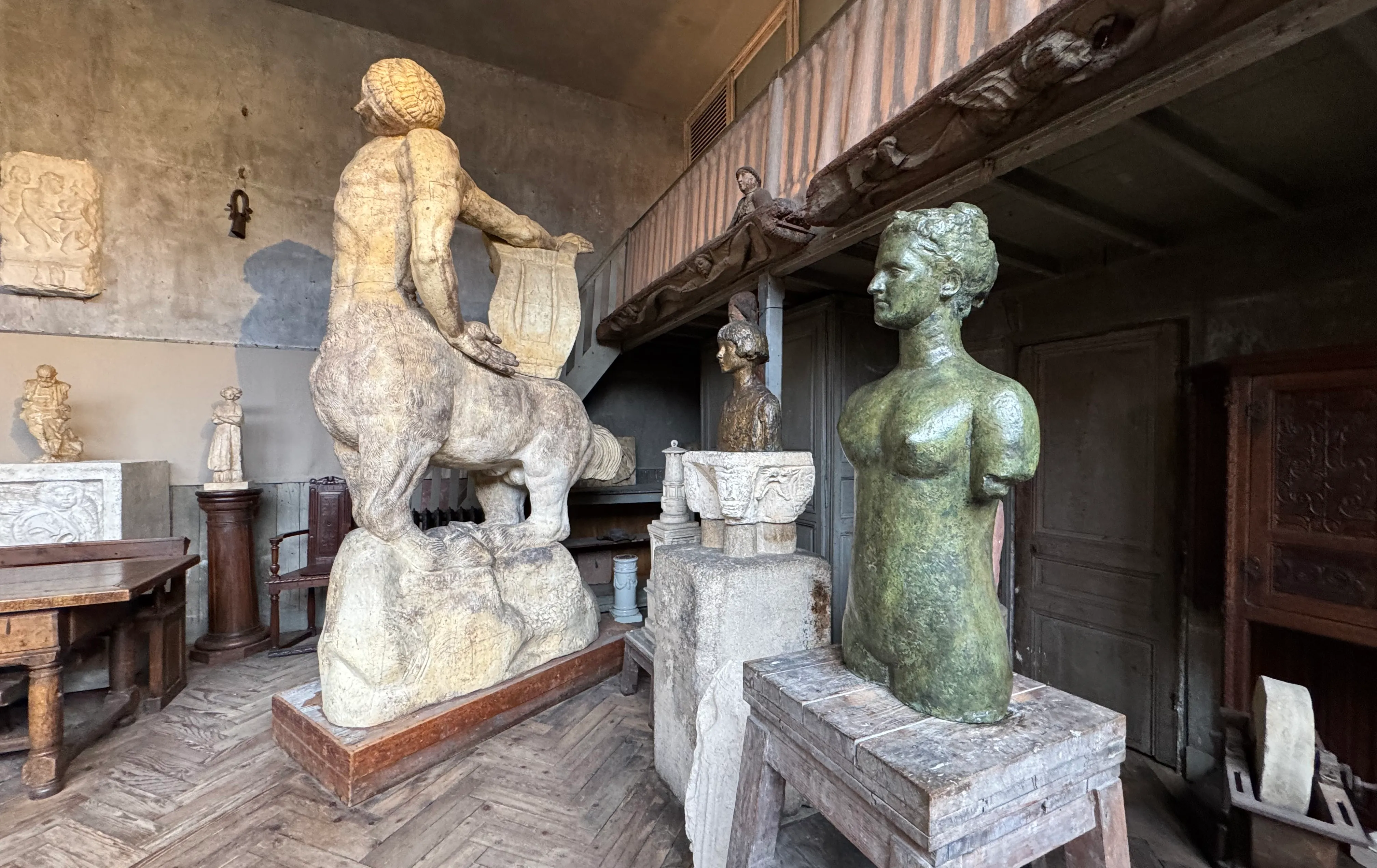 the studio where Bourdelle worked. there are a few different sculptures in frame.