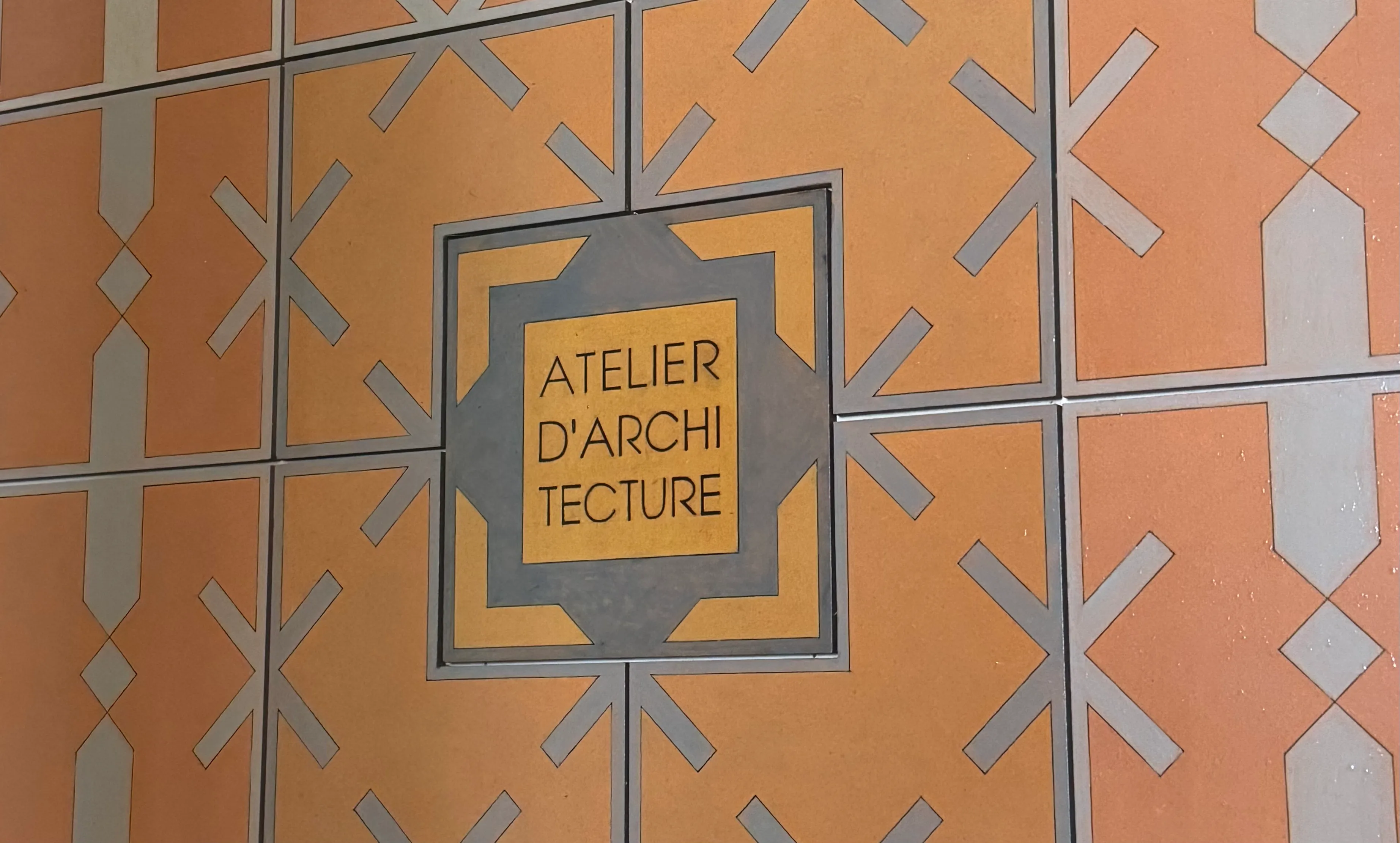 the sign on the door of the office saying atelier d&#x27;architecture