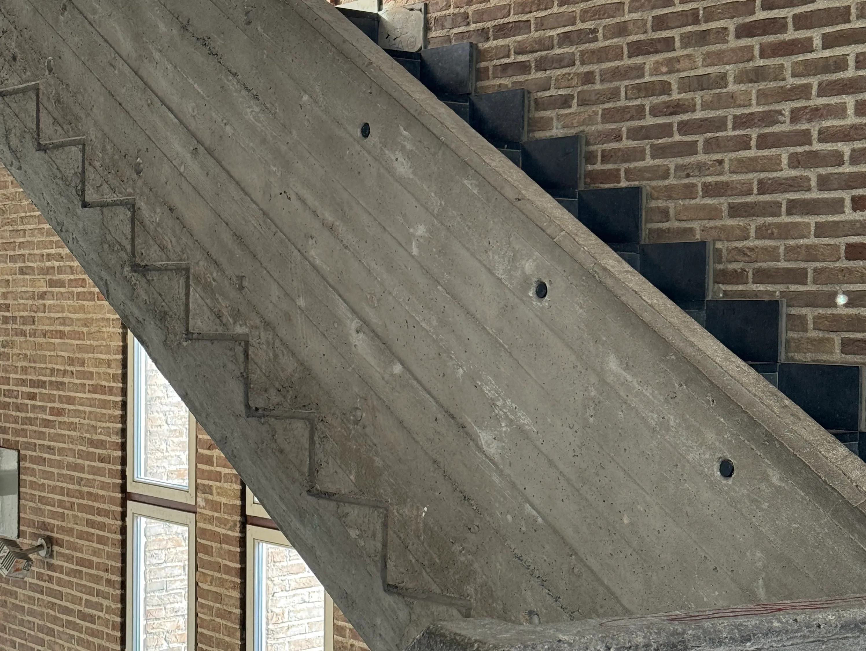 the markings of the stairs that you can see on the outside of the wall