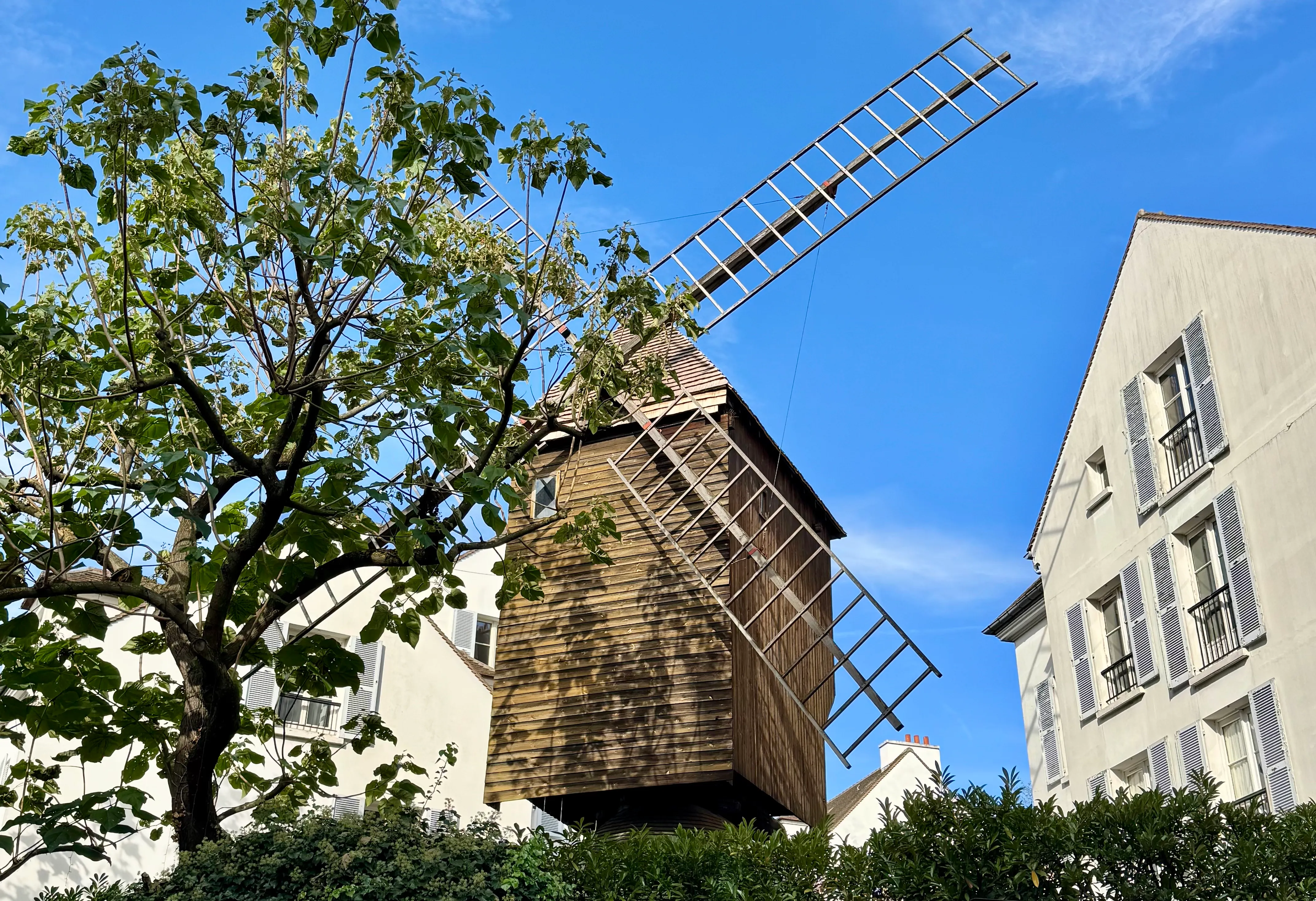 a mill above the restaurant of &#x27;le moulin de la galette&#x27;